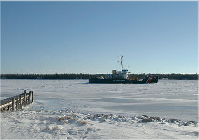 the Coast Guard cutter Acacia enters the Harbor to clear the way for the Emerald Isle